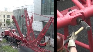 Assembling a large mobile crane that will be used to disassemble a tower crane [upl. by Asseram]