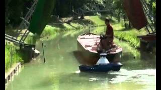 Ship passing bridge in canal with tug assistance  Port Revel Shiphandling [upl. by Ayor628]