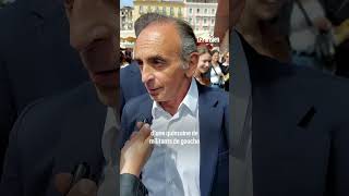 Eric Zemmour frappe une femme qui vient de lui jeter un œuf sur un marché en Corse [upl. by Jariah299]