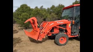 Grapple attachment on Kubota L3560 moving logs [upl. by Kahcztiy]