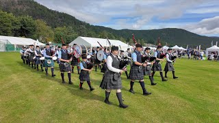 Lathallan School Pipe Band march in playing Scotland the Brave opening 2024 Ballater Highland Games [upl. by Anadroj]