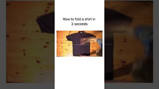 How to fold a shirt in 2 seconds howto shorts [upl. by Analed]