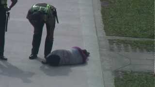 Drunk woman passed out in the street and cops walk away [upl. by Eintihw]