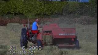 Baling hay with a MasseyFerguson 65 amp Deutz Fahr baler [upl. by Htebaile]