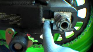 Installing the rear wheel on a motorcycle 2008 Kawasaki ZX6R example [upl. by Kcirdor]