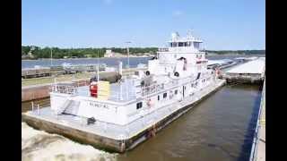 Ingram Barge Companys James F Neal Towboat Exits Lock amp Dam 15 At Rock Island Illinois [upl. by Stefan]