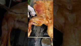 Roasted whole lamb is golden in color carne asado comida delicioso [upl. by Nhoj]