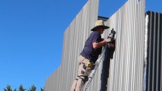 Owner Builders Finishing The Wall Cladding On DIY Steel Frame American Barn Style Shed BuildPart 7 [upl. by Colner571]