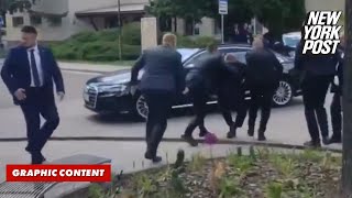 Slovakian Prime Minister Robert Fico is rushed to car after being shot [upl. by Ycats]