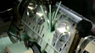 Kauffman Racing Equipment 5 axis CNC Milltronics milling of Pontiac Hemi Head with Troy Key table [upl. by Robillard779]