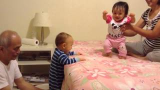 Twin babies climbing up and down the bed at grandparents 1 of 3 Sept 20 2013 [upl. by Enoek]