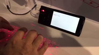 Coque iPhone clavier Laser  iPhonfr  CES 2015 [upl. by Ijnek776]