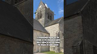 A mannequin hangs on the steeple of the church in SainteMereEglise to forever honor John Steele [upl. by Elletnuahs734]