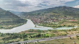 Aerial view of the merger of two rivers Kura or Mtkvari and Aragvi into one timelapse Georgia [upl. by Ling]