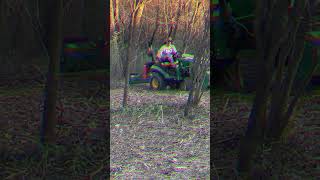 Using the Woodmaxx Flail Mower FM54 clear tree line johndeere1025r flailmower woodmaxx [upl. by Ayyn]