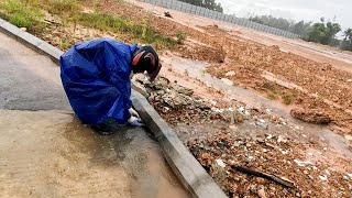 OMG Unclogging Culvert To Drain Flooding Street Blocked By Debris [upl. by Adnolrehs]