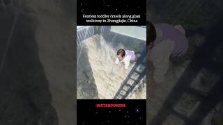 Fearless toddler crawls along glass walkway in Zhangjiajie China [upl. by Hnirt807]