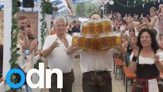 Man sets world record for carrying the most beers [upl. by Ellevehc274]