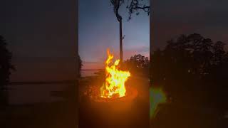 Fire burning with green in it sunset lake Timelapse timelapse fire greenfire sunset sunsetview [upl. by Ahsirak163]