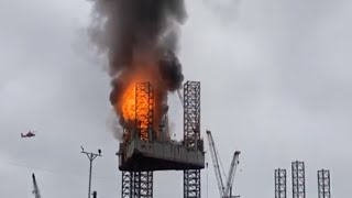 RAW Explosion as USCG helicopter moves in to rescue workers during oil rig fire at Texas shipyard [upl. by Aken]