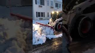 Pushing snow with the Bobcat S570 [upl. by Kcirdet910]