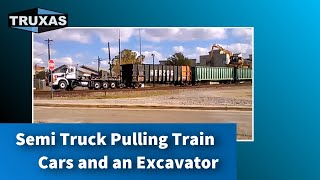 Semi Truck Pulling Train Cars and an Excavator [upl. by Nomma751]