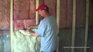 How To Install Fiberglass Batt Insulation amp Vapor Barrier [upl. by Azirb]