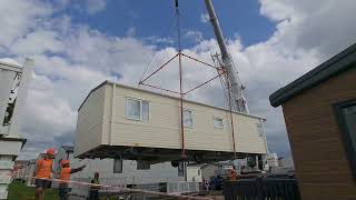 Chesil beach holiday park crane lifting caravans into place [upl. by Anehta]