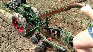 Planet jr Bp1 hilling garlic walk behind tractor cultivating [upl. by Porta]