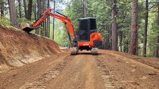 Stumps slopes and road with the Kubota KX040 [upl. by Sibbie]