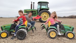 Using kids tractors to plow up hidden toys in dirt  Tractors for kids [upl. by Phaih]