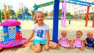 Funny Polina playing with Colored cups and baby dolls on the playground [upl. by Ailecra740]