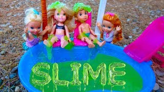 Elsa and Anna toddlers slime in the pool [upl. by Artaed478]