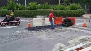 Bomag walk behind roller compactor doing asphalt premix patching work [upl. by Aehsat]