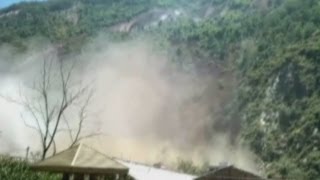 Dramatic footage Huge landslide ravages China village [upl. by Maurilia536]