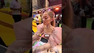 Ariana Grande DRAWS tattoos for fans at wicked premiere [upl. by Alleunamme]