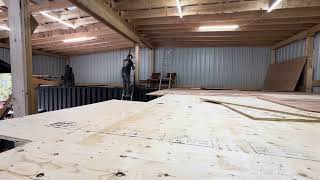 Cutting and nailing plywood floor for 2nd story in shop [upl. by Llered774]