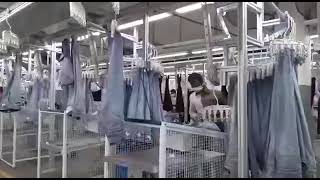 INA Hanger System in Denim FinishingThe INA Hanger System is of denim productionindustry40 [upl. by Ynohtnacram]