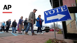 Americans head to the polls to choose between Harris or Trump [upl. by Eddi]