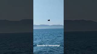 Chinook military helicopter flies over the ocean [upl. by Sarnoff]