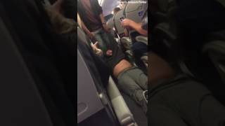 Bleeding UA passenger dragged off overbooked flight after refusing to give seat to airline staff [upl. by Ayn]