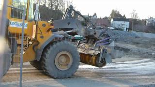 Volvo L110E with Holms sweeper working on a construction site [upl. by Hsirt]