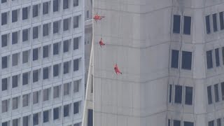 Aerial performance artists scale San Franciscos Transamerica Pyramid kicking off APEC [upl. by Ferguson141]