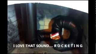 123112 Reginalds Rocket Stove Fireplace quotTHE TEST BUILDquot Movie [upl. by Catlaina545]