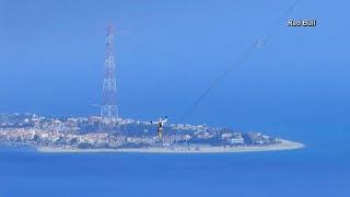 Slackliner makes history as first to walk over Italys Strait of Messina [upl. by Auqemahs]