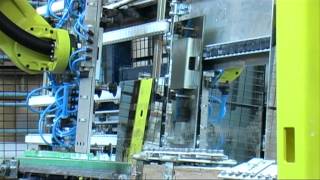 Robot handles mirrors from one conveyor to other  Company Deknudt [upl. by Ggerk]