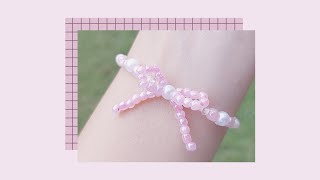 สอนร้อยกำไลลูกปัดรูปโบว์ 🎀✨ DIY Bowknot Ribbon Beaded Bracelet [upl. by Canty237]