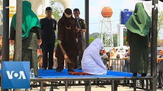 Unmarried Couple Caned in Indonesia [upl. by Plossl]