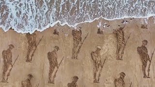 Soldiers Stenciled Into Sand for 80th Anniversary of DDay [upl. by Rachael]