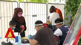 COVID19 testing under way for more than 300 residents at Punggol HDB block [upl. by Atinrahc]